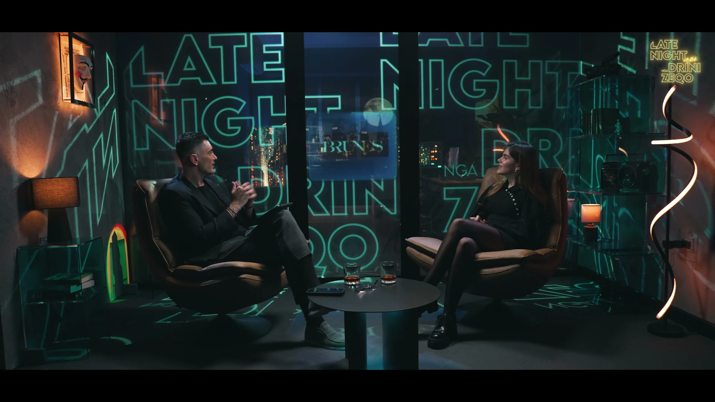 Late Night n’Bllok — Complete architectural interview set, hosts and textured luminous backdrop without promotional title overlay.