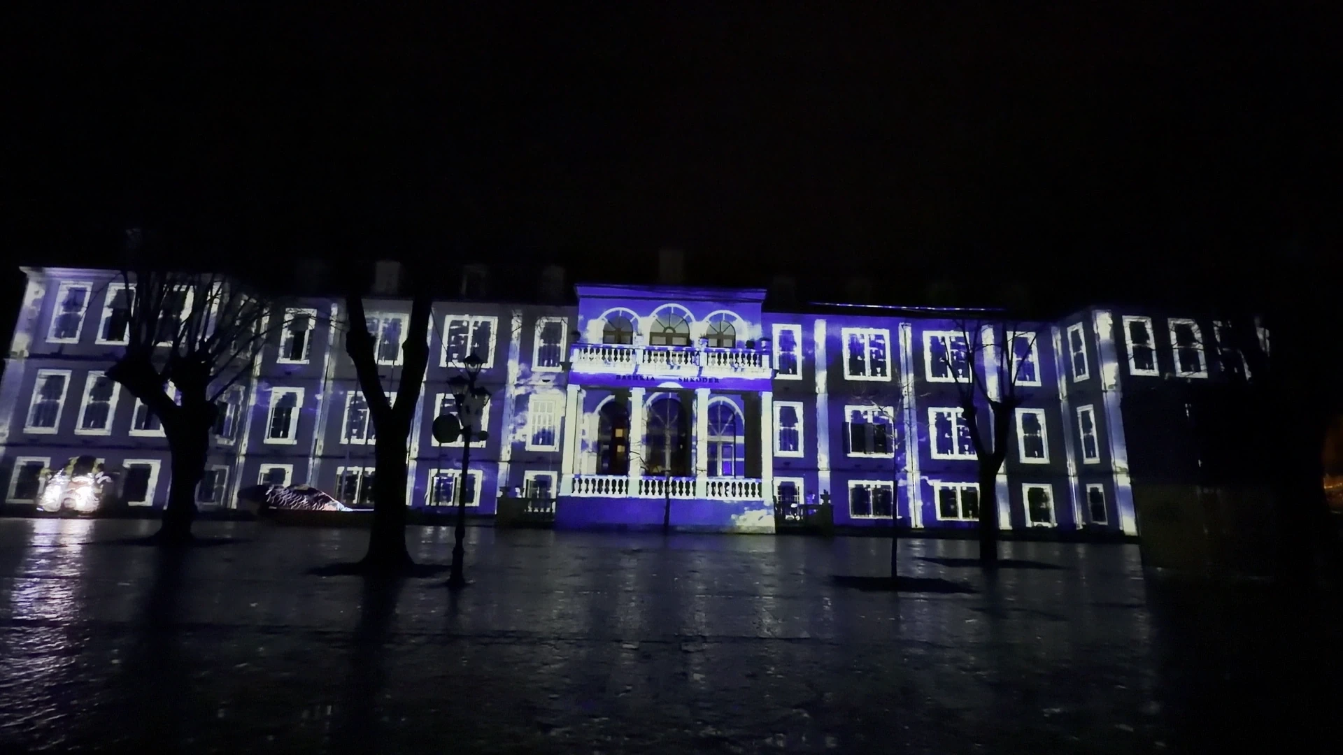 Shkodër Carnival 2026 — Municipality façade — Electric blue and white window illusions