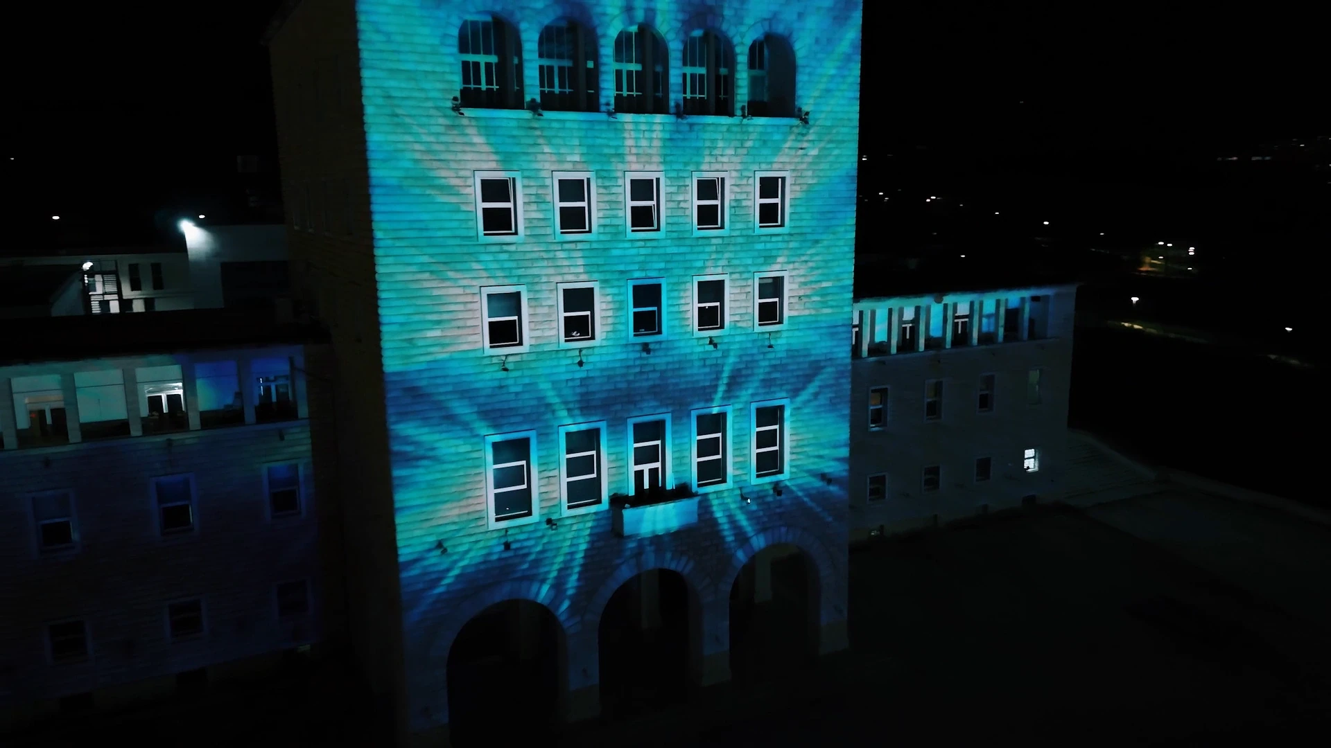 UKT Water Day — Tirana University — Turquoise geometric façade at an oblique angle